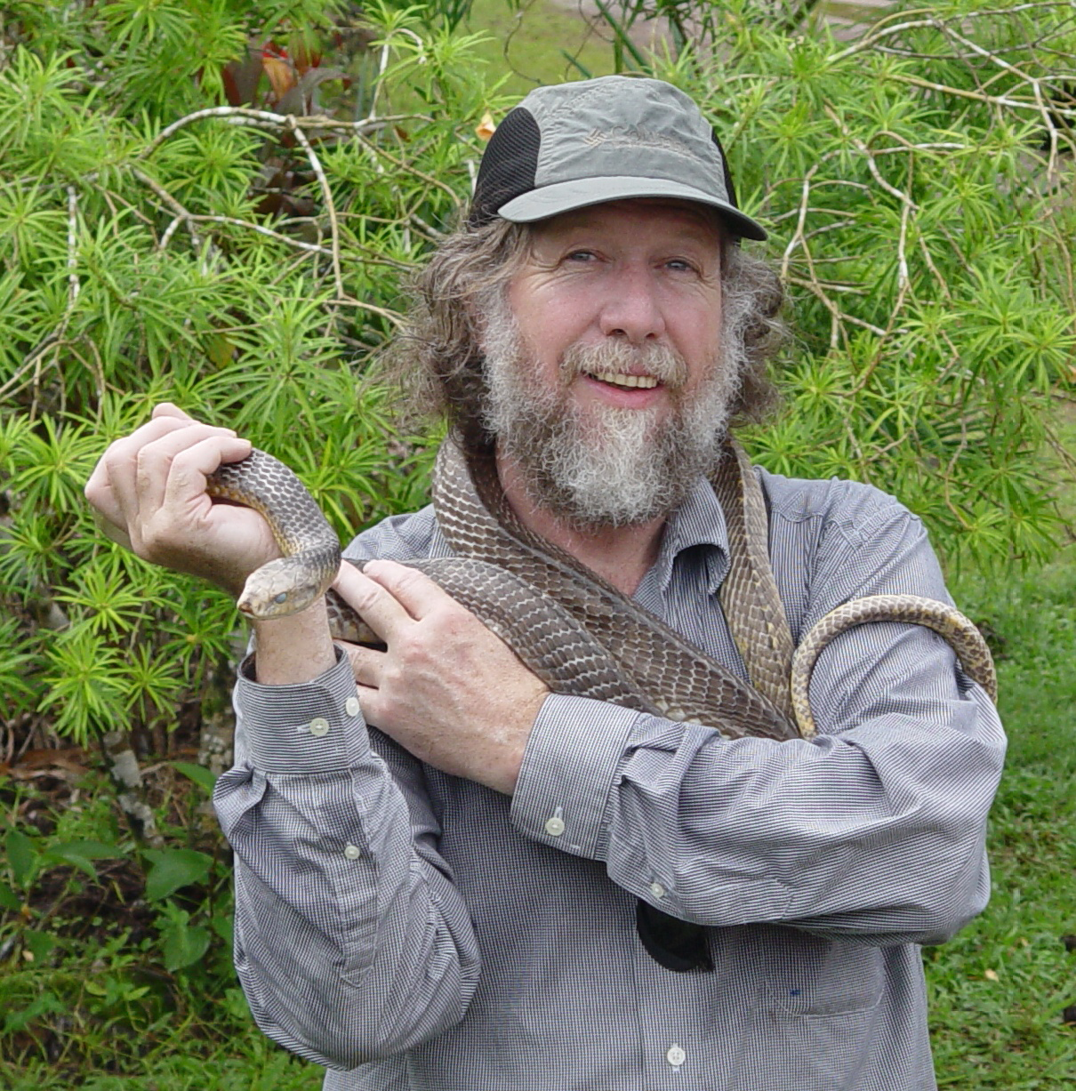 James Bogan holding on to a snake